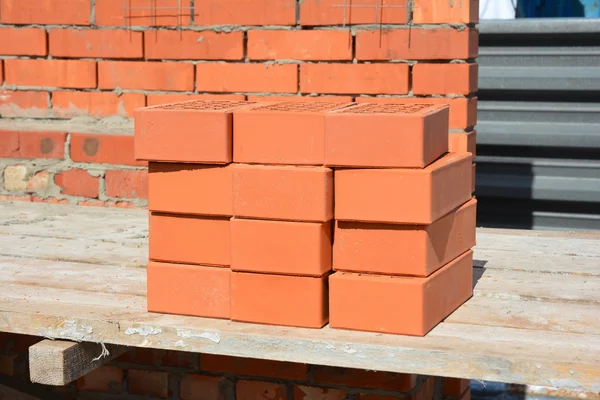 Close up on Bricklaying House Construction Site. How To Lay Bricks Like A Bricklayer