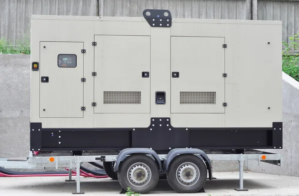 Big Backup Mobile Generator for Office Building Connected to the Control Panel with Cable Wire to the Office Building