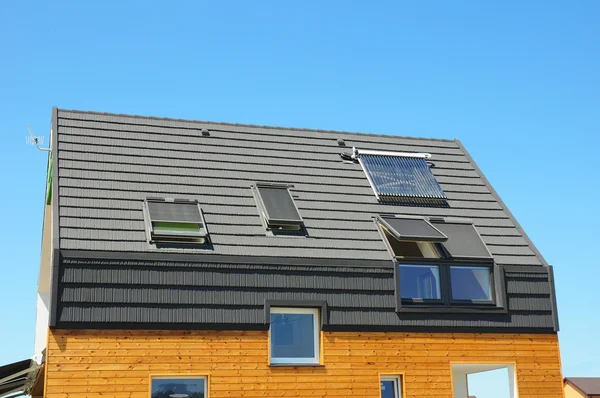 Closeup of Solar Water Panel Heating, Dormers, Solar Panels, Skylights, Ventilation and Air Conditioning Systems Installed