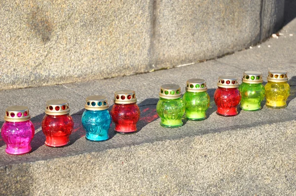 Funeral candles on the stone stairs