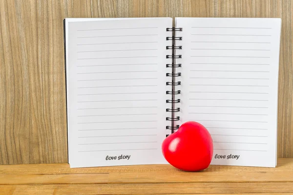 Blank book and red heart with text 