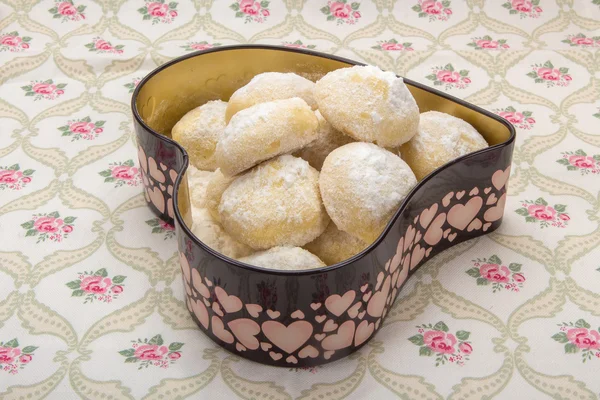 Small cookies in a tin box in heart shape