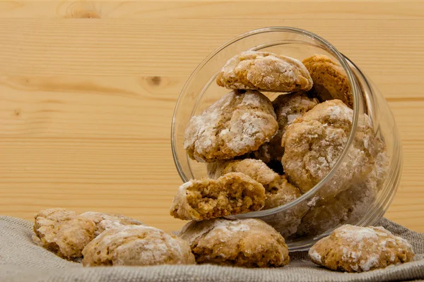 Glass jar with Italian cookies amaretti dropped out 3