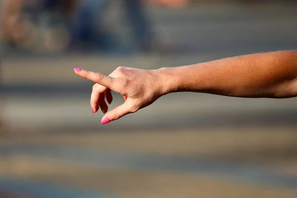 Women right hand on blurred background