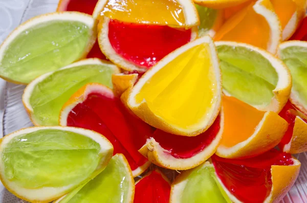 Party treat - colorful jelly in peel of oranges