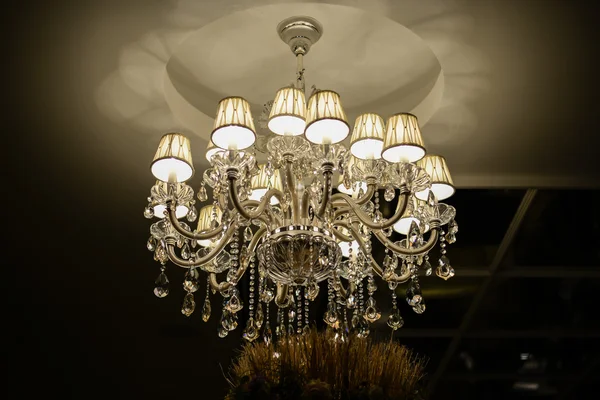 Luxury Chandelier hanging from a ceiling