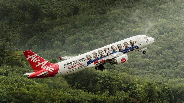 Airasia airways airplane take off  at phuket after rain stop