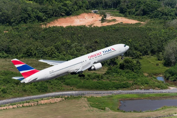 Orient Thai airways airplane take off at phuket airport