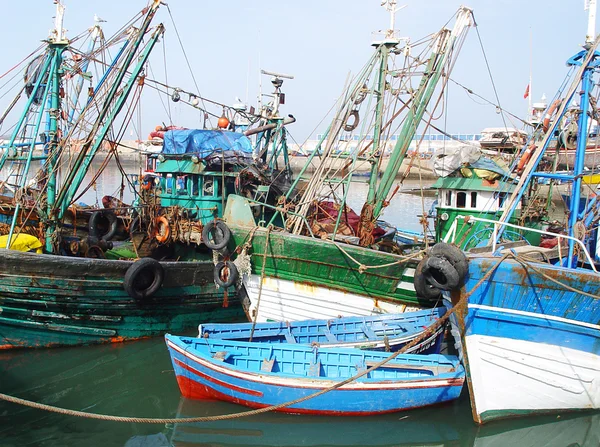 Old fishing boats and motor-boats in the harbor of Agadir