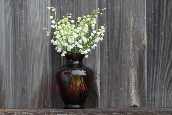 Vase with lilies of the valley