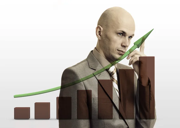 Businessman drawing rising graph, development and growth concept