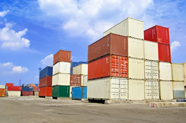 Stacked cargo containers in storage area of freight sea port ter