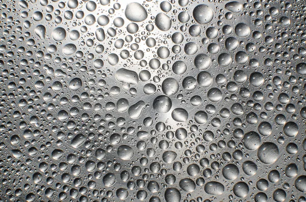 Water drops on metal shiny surface