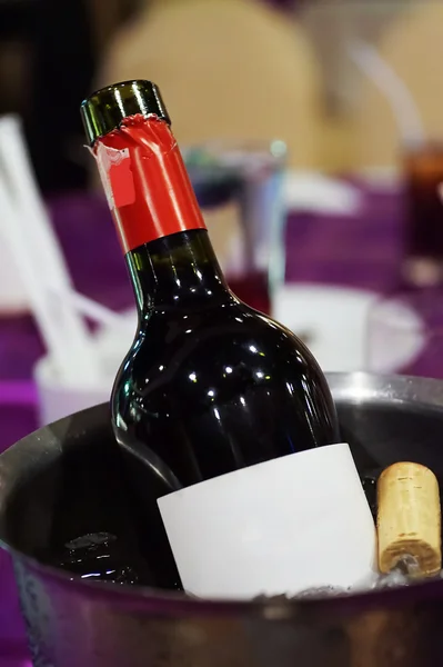 Wine bottle in ice bucket with blur background