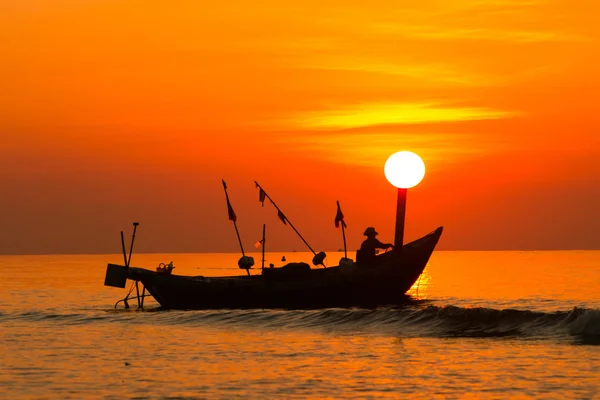 Fishermen on boat in sunrise in Hai Ly, Nam Dinh