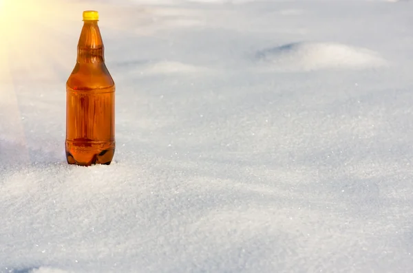 Beer in plastic bottles on snow