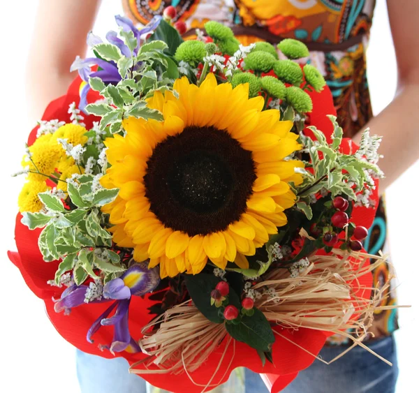 Woman holding beautiful birthday flower with sunflower
