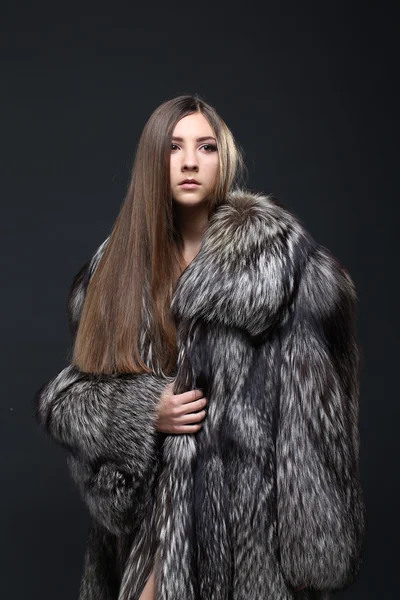 Portrait of a seductive lady in fur coat