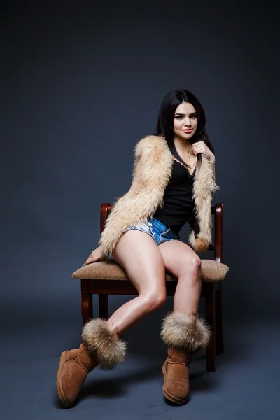 Portrait of a seductive lady in fur coat