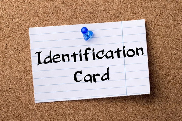 Identification Card - teared note paper pinned on bulletin board