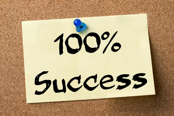 100% Success - adhesive label pinned on bulletin board