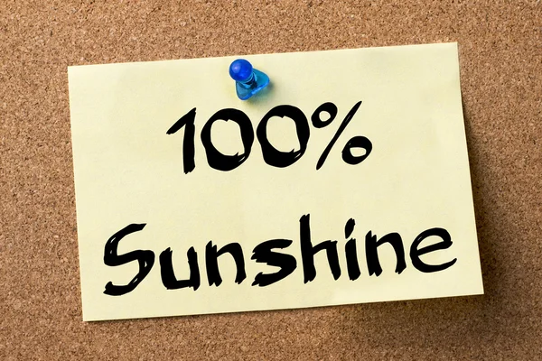 100% Sunshine - adhesive label pinned on bulletin board