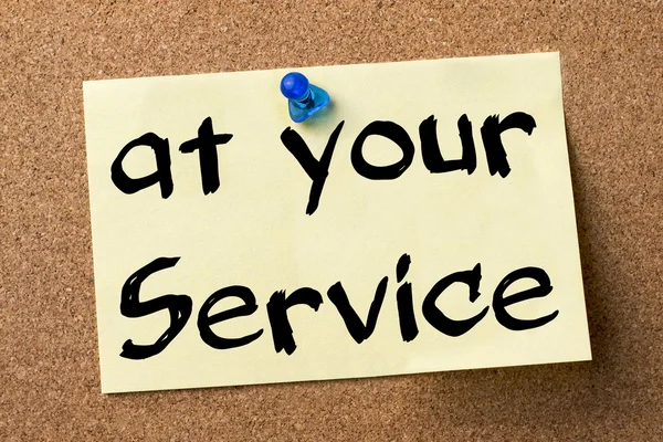 At your service - adhesive label pinned on bulletin board