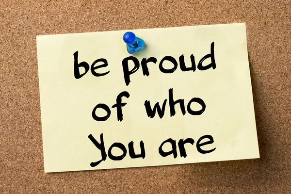 Be proud of who You are - adhesive label pinned on bulletin boar