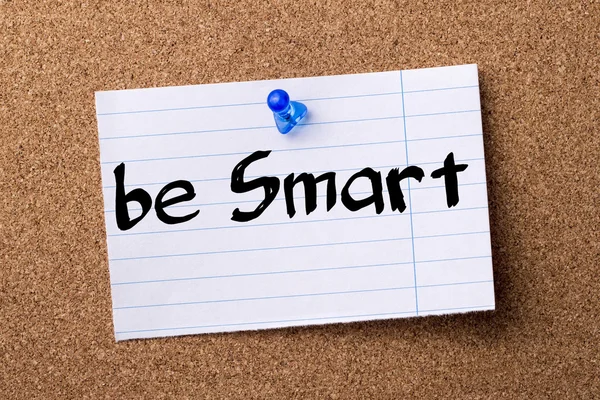 Be Smart - teared note paper pinned on bulletin board