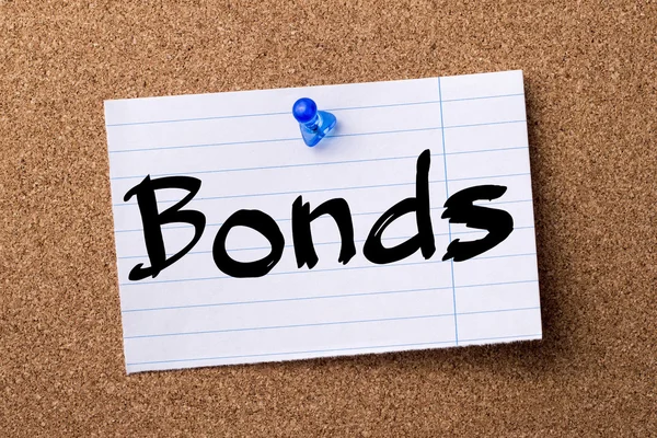 Bonds - teared note paper pinned on bulletin board