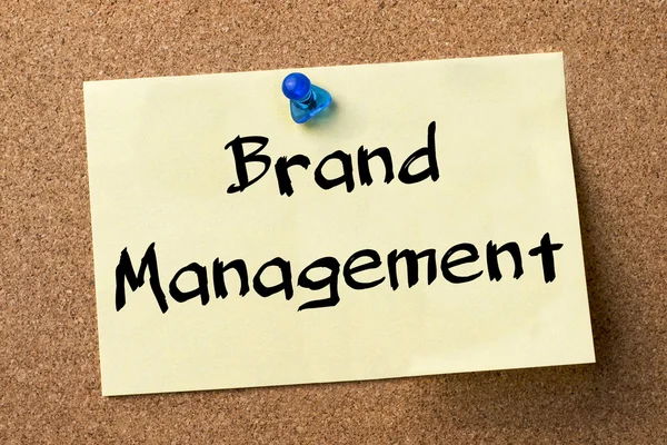 Brand Management - adhesive label pinned on bulletin board