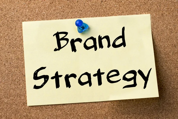Brand Strategy - adhesive label pinned on bulletin board