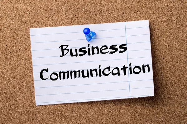 Business Communication - teared note paper pinned on bulletin bo