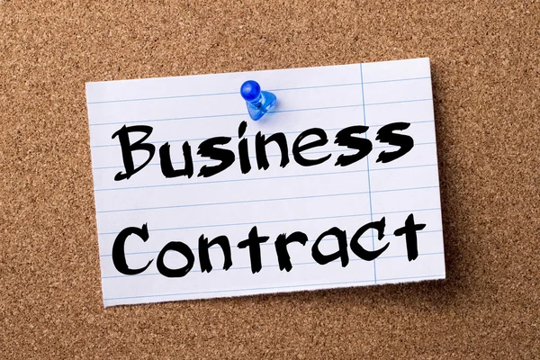 Business Contract - teared note paper pinned on bulletin board