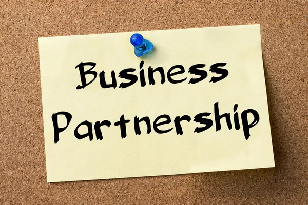 Business Partnership - adhesive label pinned on bulletin board