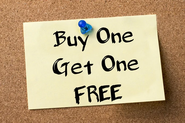 Buy One Get One FREE - adhesive label pinned on bulletin board