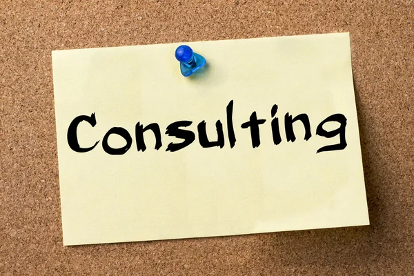 Consulting - adhesive label pinned on bulletin board