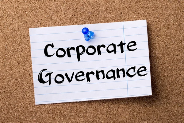 Corporate Governance - teared note paper pinned on bulletin boar