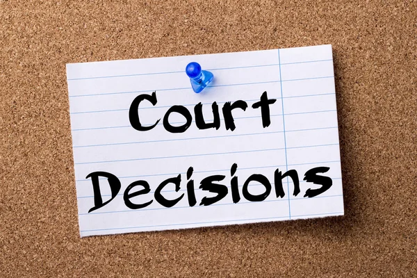 Court Decisions - teared note paper pinned on bulletin board