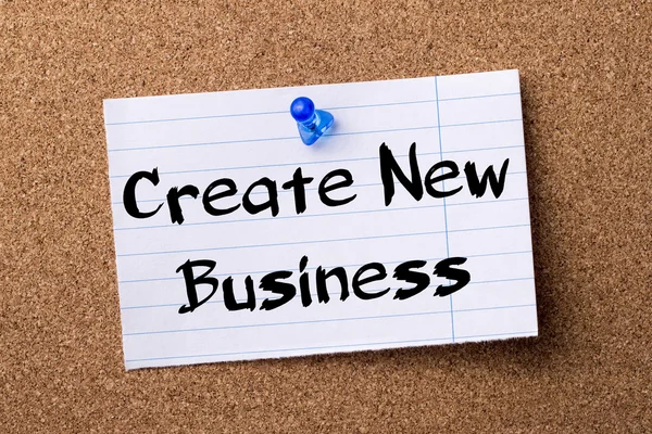 Create New Business - teared note paper pinned on bulletin board
