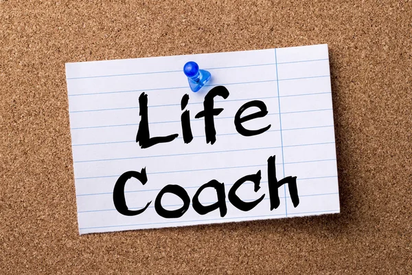 Life Coach - teared note paper pinned on bulletin board