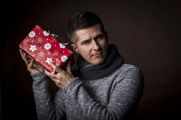 Young man with Christmas gift