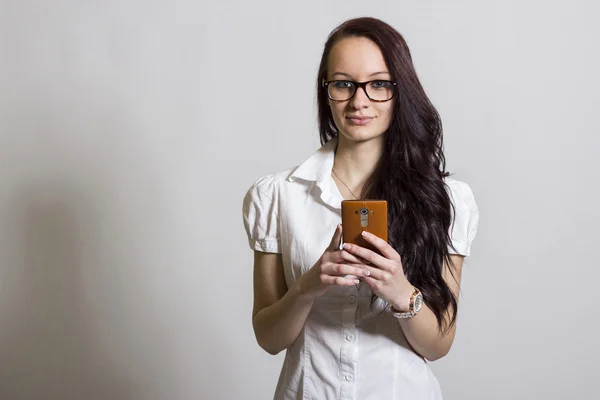 Young beautiful woman with mobile phone