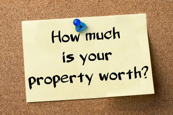How much is your property worth? - adhesive label pinned on bull