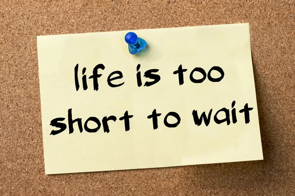 Life is too Short to Wait - adhesive label pinned on bulletin bo