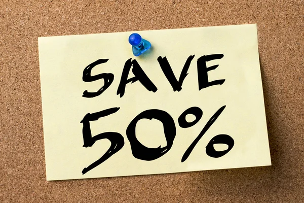 SAVE 50 percent - adhesive label pinned on bulletin board