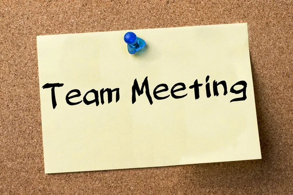 Team Meeting - adhesive label pinned on bulletin board