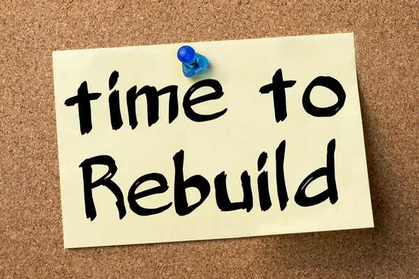 Time to Rebuild - adhesive label pinned on bulletin board