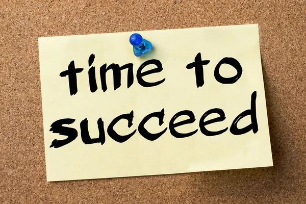 Time to succeed - adhesive label pinned on bulletin board