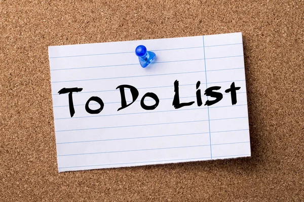 To Do List - teared note paper  pinned on bulletin board